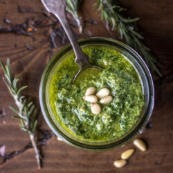 A jar filled with Arugula Pesto.