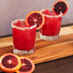 Dive into this tangy Blood Orange Margarita recipe. Fresh Blood Orange juice paired with tequila, lime juice and simple syrup, to create a colorful spring-time cocktail!