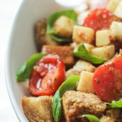 Caprese Panzanella salad in a white bowl.