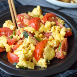 Chinese stir fried tomatoes and eggs on a plate.