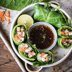 Collard leaf wraps served with dipping sauce.