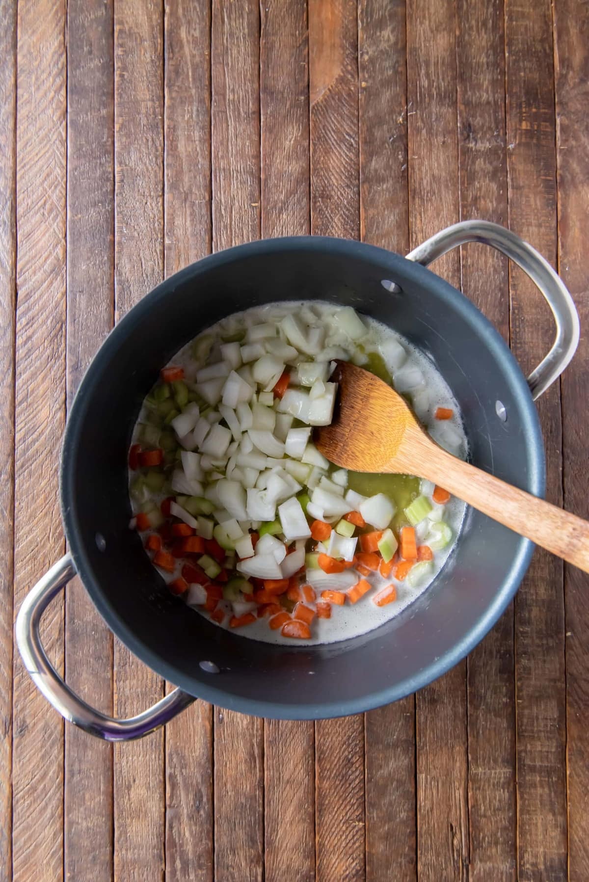Pot with celery, onion, and carrots.