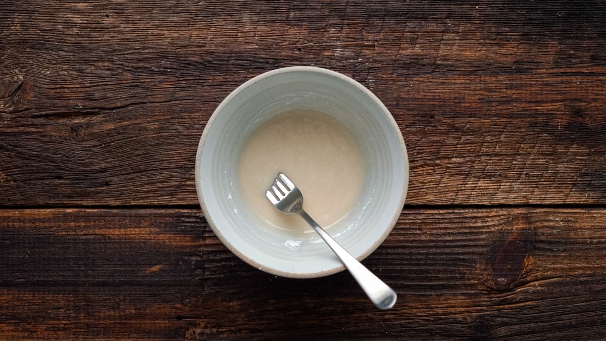 Mixing together the ingredients for the icing.