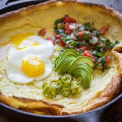 A Dutch Baby in a cast iron skillet.