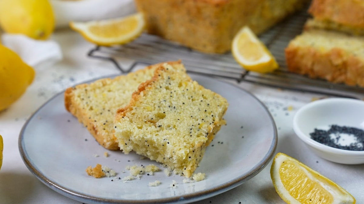 Yellow summer squash bread on a white plate.