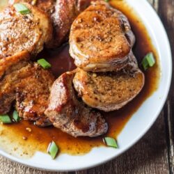 Easy Pork Tenderloin with Maple-Balsamic Sauce elegantly presented on a platter.