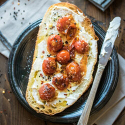 Mascarpone Toast on a black plate.