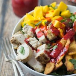 A bowl of Mexican Chicken Salad, drizzled with chipotle raspberry dressing.
