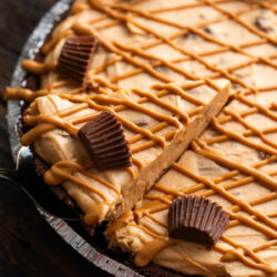 Indulge in this Reese's Pie Recipe. Smooth and creamy peanut butter mixed with classic Reese's Peanut Butter Cups make a scrumptious sweet treat!