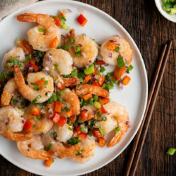 Dive into these light and crisp Salt and Pepper Shrimp. Fresh shrimp lightly breaded and cooked with an array of diced veggies.