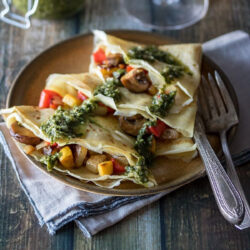 Savory crepes served on a plate.