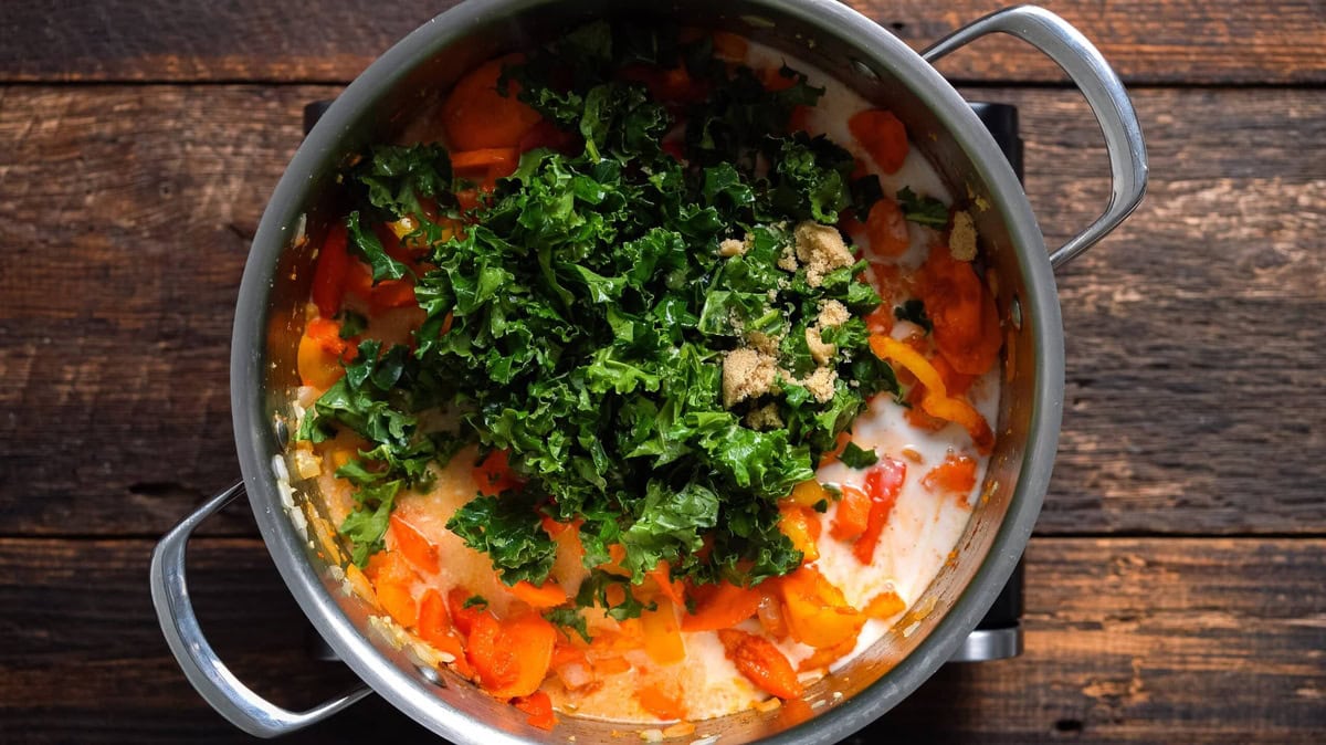 Added coconut milk, kale, and sugar for the Vegan Thai red curry.