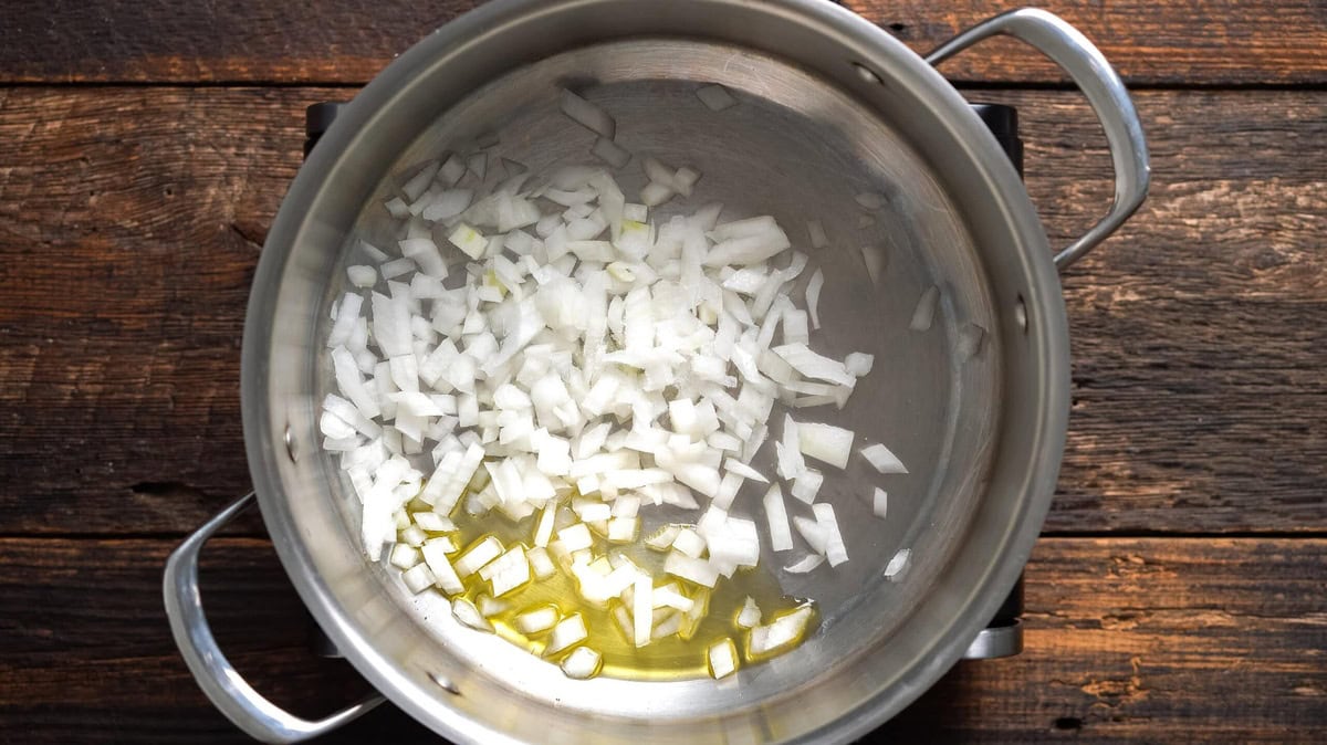 Cooking onion in a skillet.