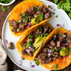 These Vampiro Tacos are a delicious fusion of crispy tortillas, and juicy marinated steak, topped with melted cheese and fresh guacamole.
