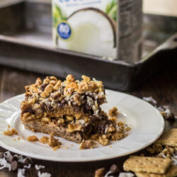 Vegan magic cookie bars on a plate.