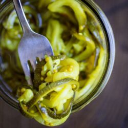 Close-up view of pickled zucchinis.